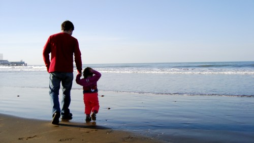 father and daughter on beach